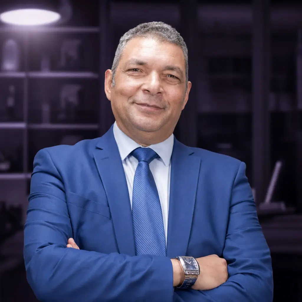Dr Mohamed El‑Ashram in a blue suit, global hatchery strategist and poultry scientist